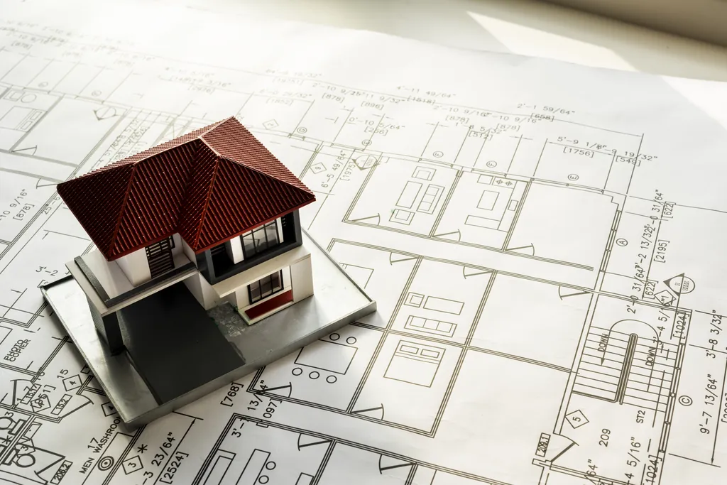 Architectural model of a house on building plans