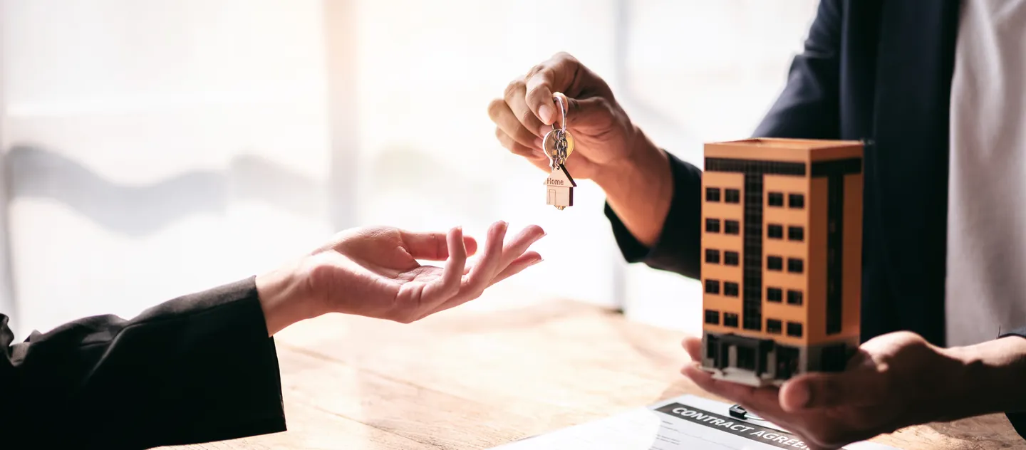 House keys being handed over at the signing of a purchase