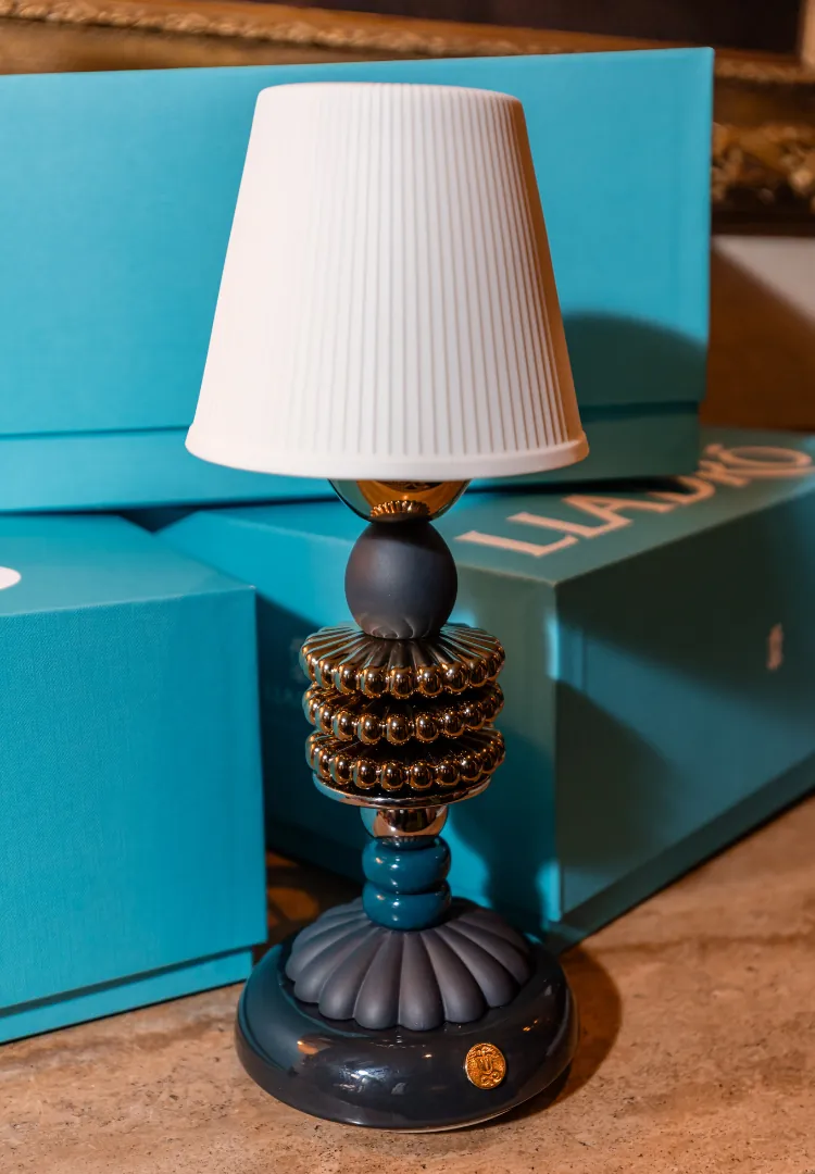 Lladró Firefly lamp with its translucent porcelain shade on a Lladró box
