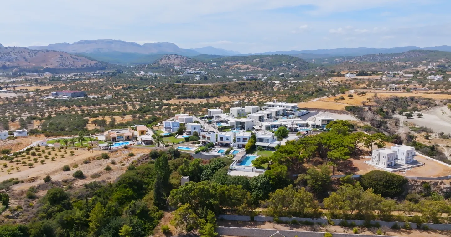 White villas scattered over green hills and olive groves inland from Marbella